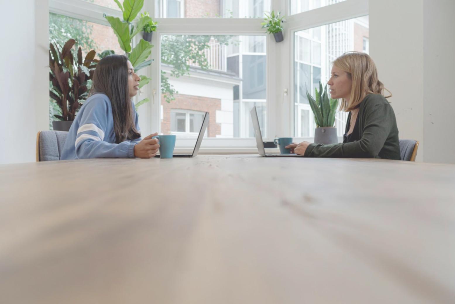 Professional workspace with financial planning materials and laptop